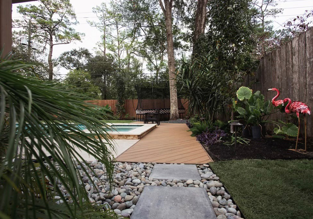 residential home with a pool and beautiful landscape in back yard