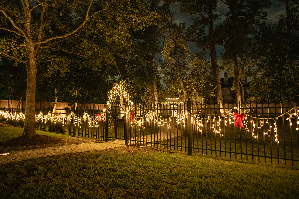 Christmas Lights on a fence houston