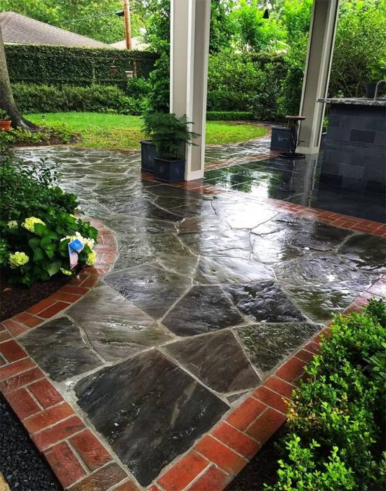 Backyard landscaping design showcasing well‑maintained shrubs and plants in Houston, TX