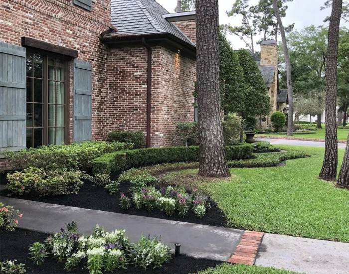 Landscaping maintenance service offered to a brick house in Houston, TX