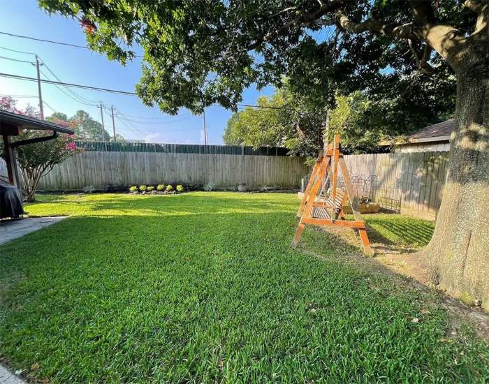 Residential lawn showing a neatly mowed yard and healthy green grass in Houston, TX
