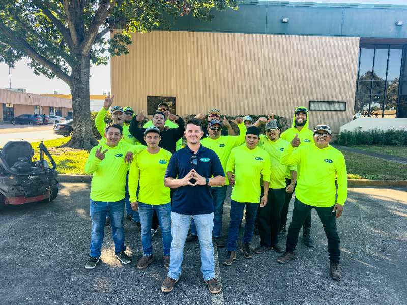 Absolute Lawn Care & Landscape Team together