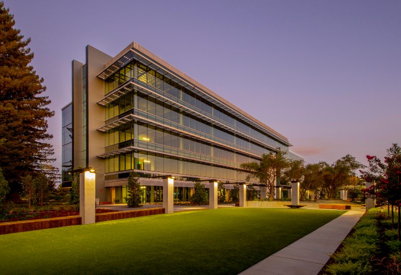 Commercial artificial turf installed in front of a modern office building in Houston, TX